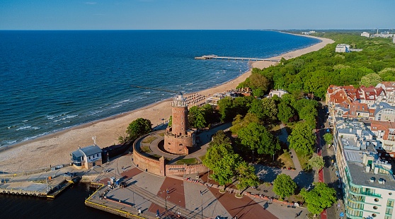Drone view in the sunny day of lighthouse and harbor in Kolobrzeg, Poland.