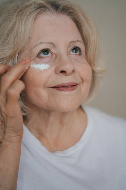 istock Young woman applying eye patches 1587295201