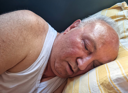 Senior Man sleeping In bed
