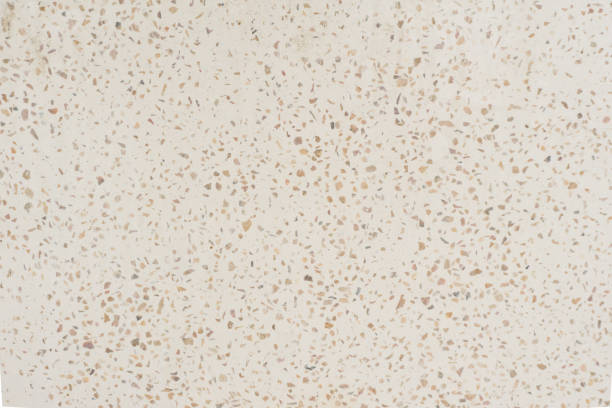 istock Light beige wall natural stone granite tile background texture closeup 1587302228