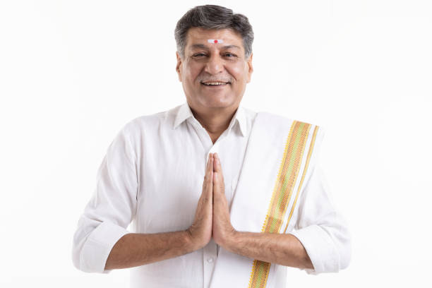 Smiling south indian senior men greeting in prayer pose