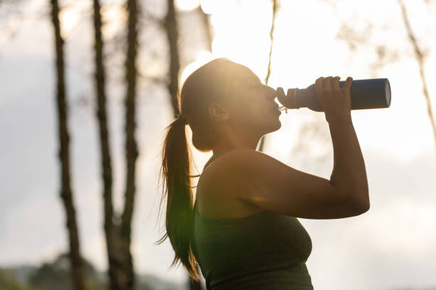 istock Drinking water from a metal bottle 1587321221