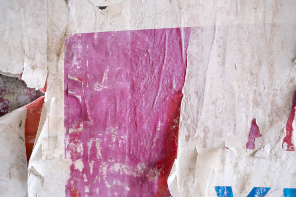 istock Torn and ripped street poster background, abstract old paper collage 1587328848