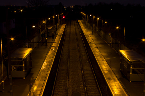 Railroad at night from an elevated central angle