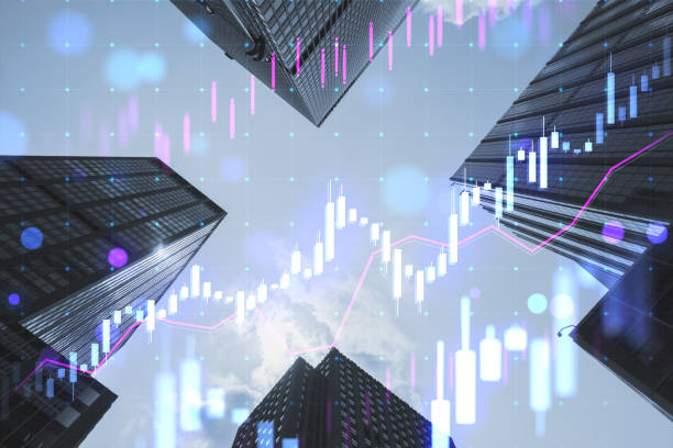 istock Creative glowing candlestick forex chart on blurry city buildings texture. Technology, trade and financial data concept. Double exposure. 1587363729