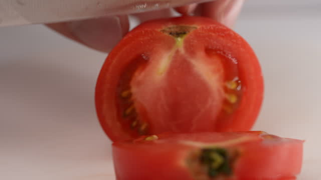 scene of cutting tomatoes