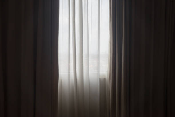 istock Window curtain semi transparent white color 1587398902