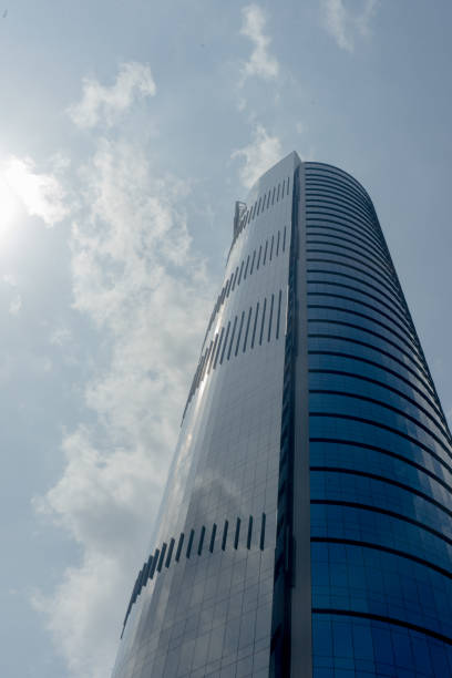 istock Commercial office building skyscraper glass structure tall on blue sky 1587408768