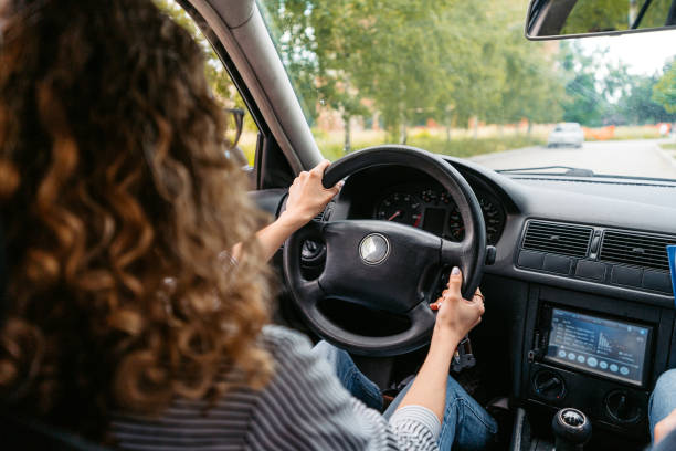 istock Young Woman Driving A Car 1587410952