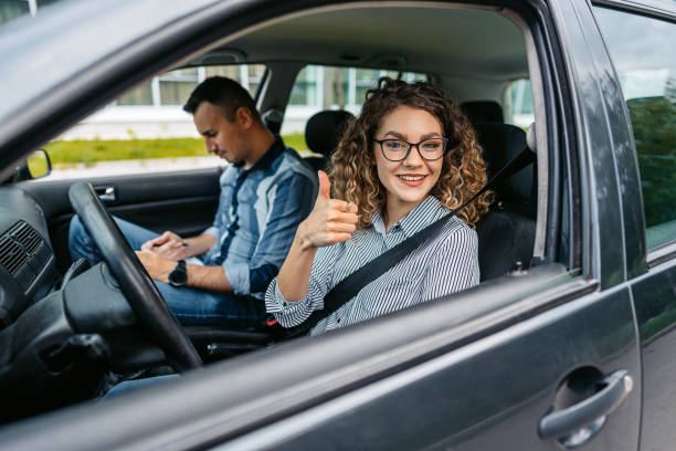 istock Young Woman Taking A Driving Test 1587422678