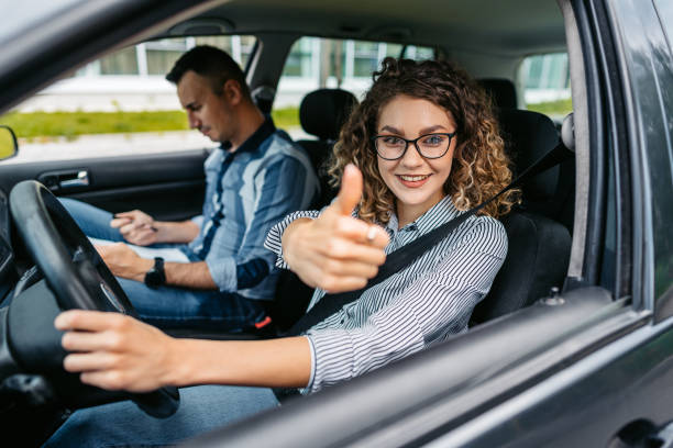 istock Young Woman Taking A Driving Test 1587431463