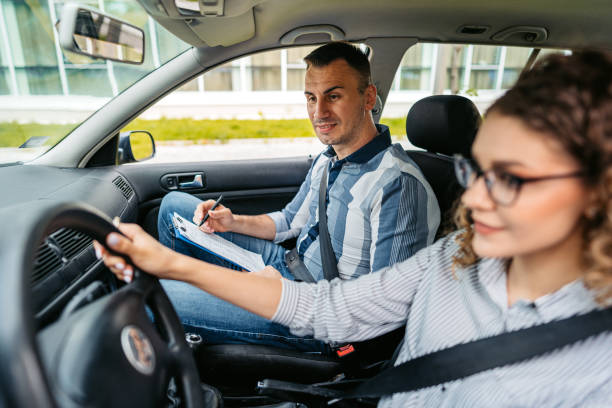 istock Young Woman Taking A Driving Test 1587431480