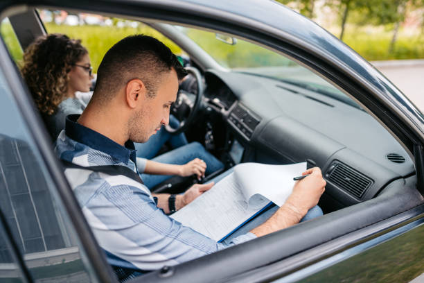 istock Young Woman Taking A Driving Test 1587433062