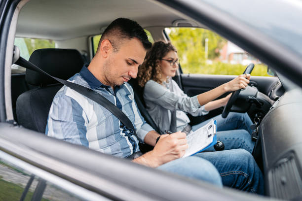 istock Young Woman Taking A Driving Test 1587433090