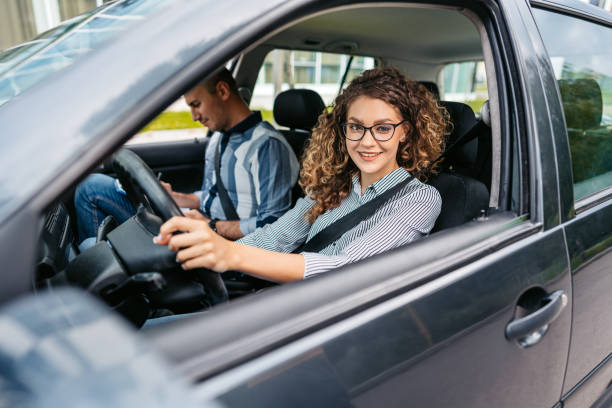 istock Young Woman Taking A Driving Test 1587433632