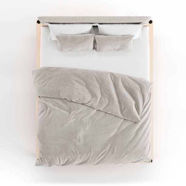 istock 3D render of a cozy double bed with white sheets and a grey blanket 1587457854