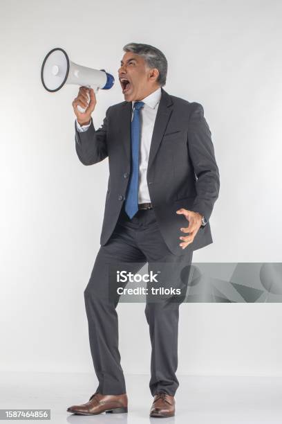 Angry Professional Screaming Into Megaphone On White Background Stock Photo - Download Image Now