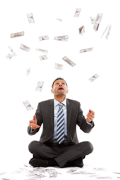 istock Male businessman catching money falling from sky 158749394