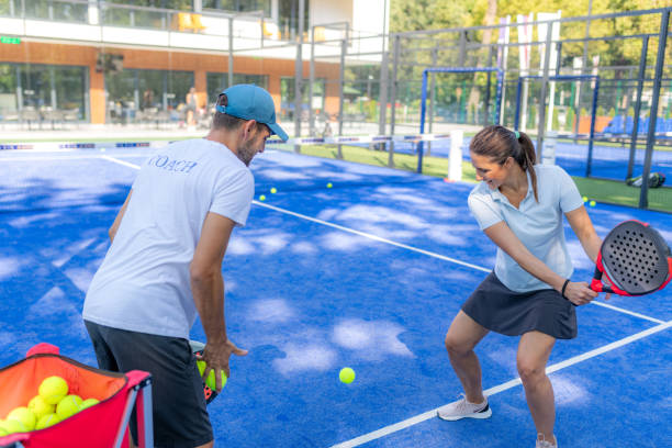 istock Dynamic padel training with a skilled coach and female player 1587505353