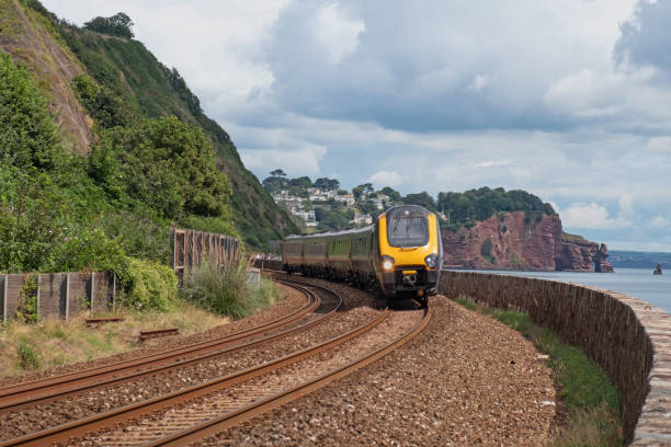 istock Passenger train on the south Devon coastal route 1587515463