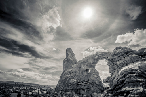 Turret Arch, Arches National Park. The photo was taken with the HDR technique which combines photos taken at different exposure and blended together. It was then converted to black and white.