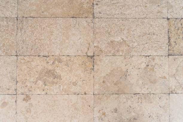 istock Natural granite stone light brown flooring tile detail texture 1587534589
