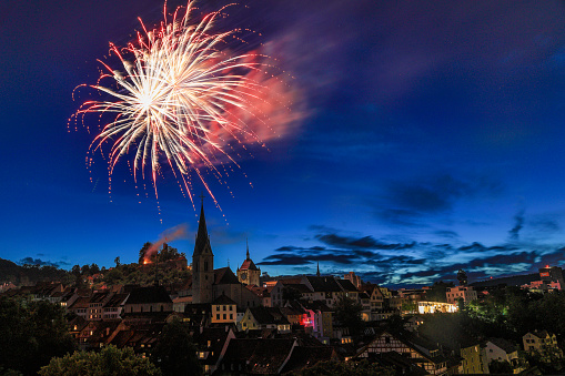 Baden, Switzerland - 01. August 2023: the old Swiss city Baden celebrates the National Day with firework on the castle ruins Stein on the 1. August each year.