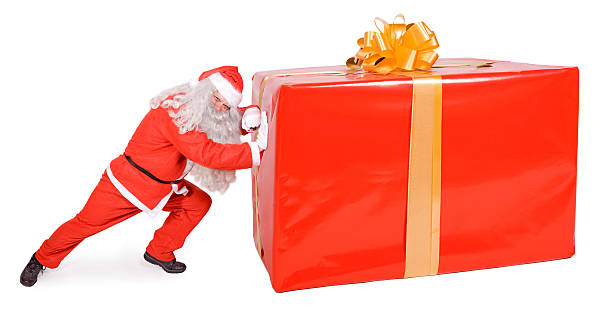 istock Santa Claus pushing a big gift 158755171