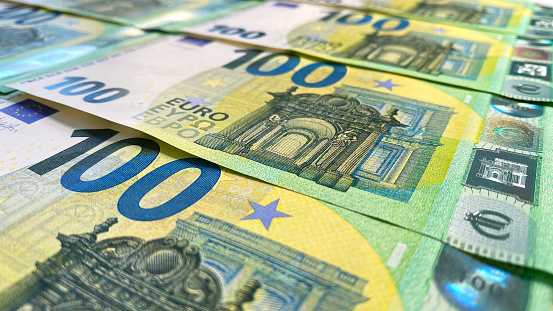 Background of money. Cash banknotes of one hundred euros. European currency. 100 euro bills. Business, economics and finance. The single currency of the European Union.