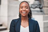 Laughing, lawyer or portrait of happy black woman with joy or confidence working in a law firm. Face, empowerment or proud African attorney with leadership, smile or vision by legal agency building