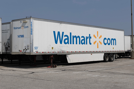 Indianapolis - August 1, 2023: Walmart tractor trailer product transport. Walmart offers goods in local stores, on the internet, and the Walmart app.