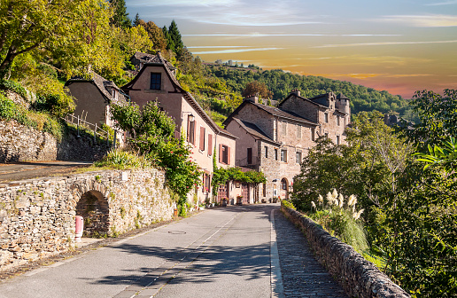 Streets of Conques in the mountains of southern France at sunset