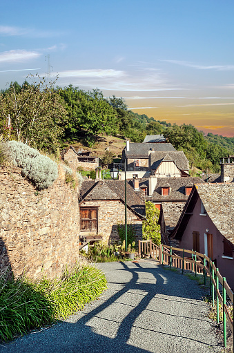 Streets of Conques in the mountains of southern France at sunset