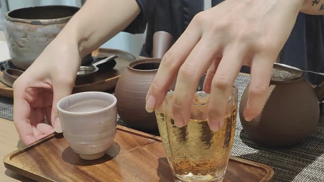 Barista Preparing Fresh Hot Tea For Customer