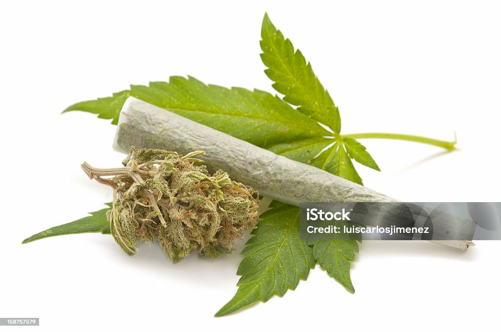 Hemp (cannabis) marijuana cigarette and green Leaf Isolated on white background Addiction Stock Photo