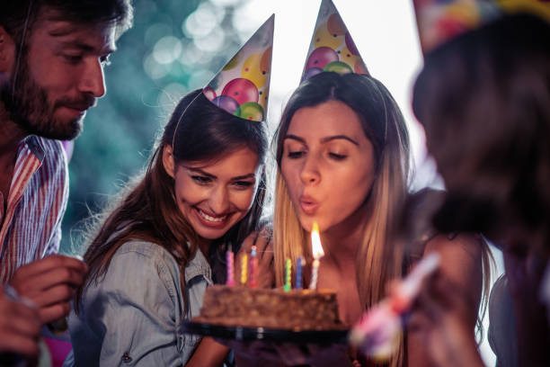 istock Group of friends celebrating birthday 1587598244