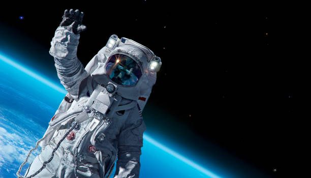 International day of human space flight, Cosmonautics Day concept 12 April 1969, International day of human space flight, Cosmonautics Day concept with ISS astronaut in spacesuit against background of the Earth planet. Spaceman in outer space 3D science illustration outer space stock pictures, royalty-free photos & images