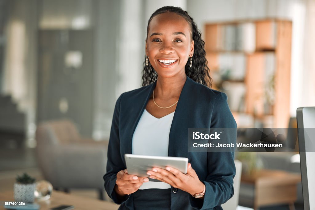 Portrait, lawyer and black woman with tablet, smile and happy in office workplace. African attorney, technology and face of professional, female advocate and legal advisor from Nigeria in law firm. Business Person Stock Photo