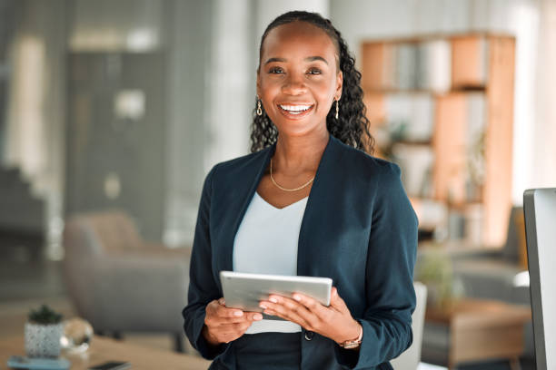 Portrait, lawyer and black woman with tablet, smile and happy in office workplace. African attorney, technology and face of professional, female advocate and legal advisor from Nigeria in law firm. Portrait, lawyer and black woman with tablet, smile and happy in office workplace. African attorney, technology and face of professional, female advocate and legal advisor from Nigeria in law firm. professional portrait stock pictures, royalty-free photos & images