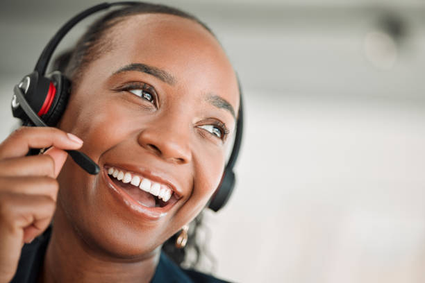 istock Thinking, call center and black woman with a smile, customer service and internet connection with telecom sales. Female person, consultant or agent with crm, decision or telemarketing with headphones 1587604849