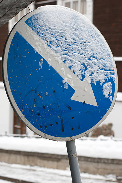 istock Keep right sign. Old curve sign covered with snow 158762156