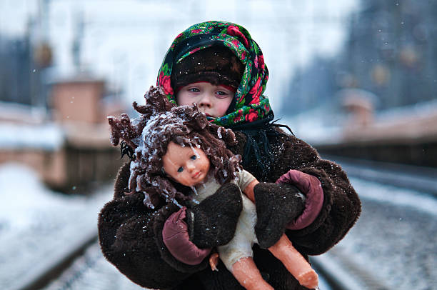 the girl with a doll/девочка с куклой stock photo