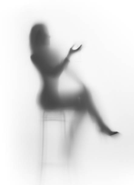 istock Woman sits on chair behind a curtain 158762304