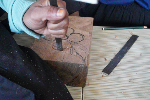 Shaping wood  carving wooden plank