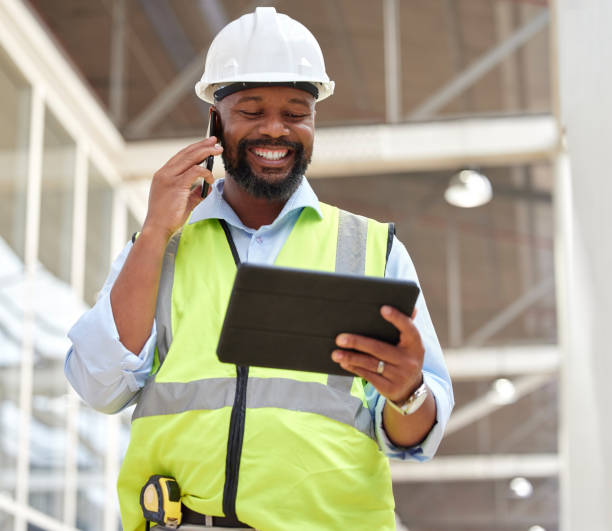 istock Phone call, black man and architect with tablet for research, planning and working on construction project. African engineer, mobile technology and happy contractor on internet, email and networking. 1587635602