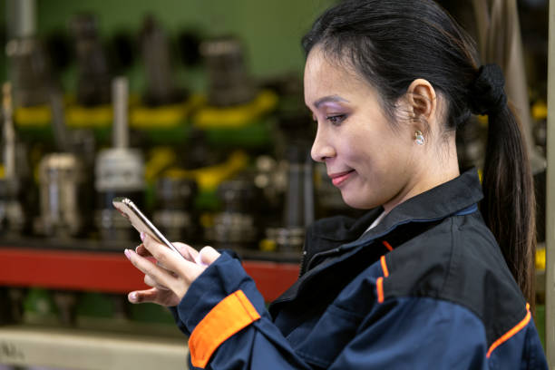 istock Woman worker at the machine 1587637550