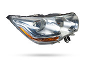 Stylish xenon headlight of a German car - optical equipment with a lamp inside on a white isolated background. Spare part for auto repair in a car workshop.