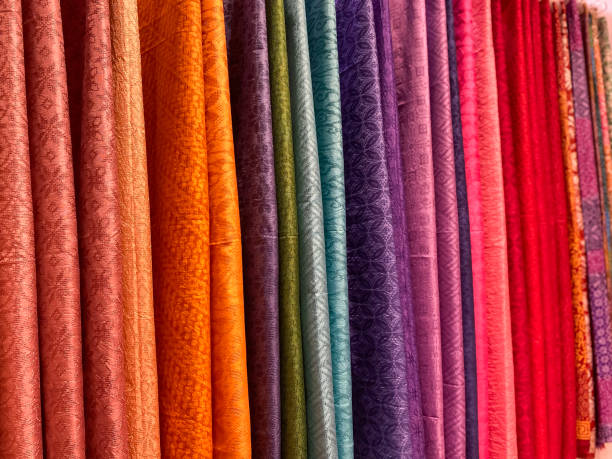istock Pile of colourful batik cloth 1587640124