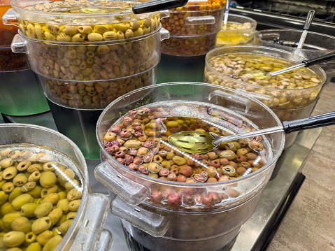 Different kind of olives in a retail display