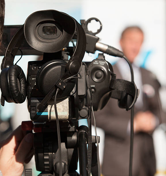 istock Covering an event with a video camera 158765061